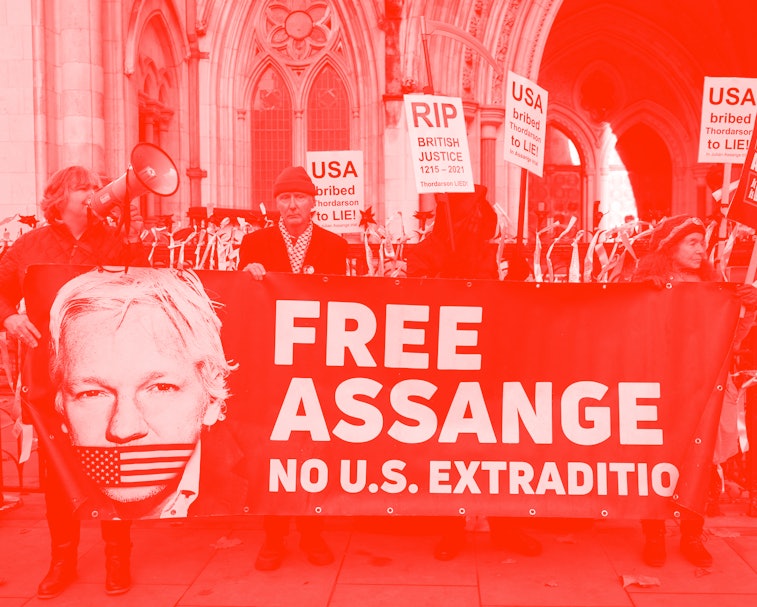 Supporters of WikiLeaks founder Julian Assange, hold placards outside the Royal Courts of Justice in...