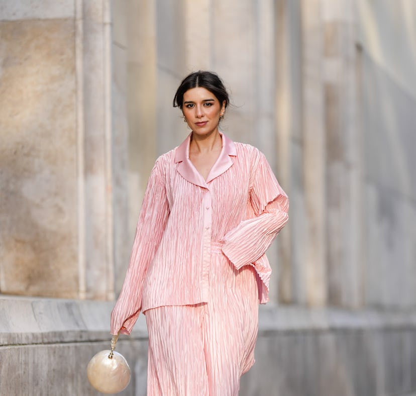 Katie Giorgadze wears pleated pink pajama set.