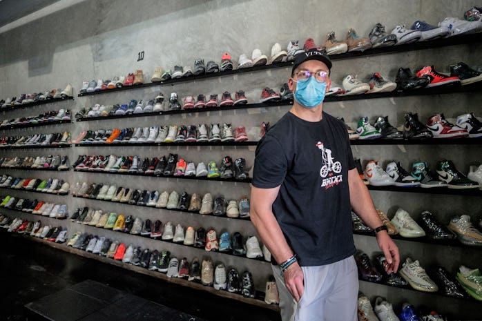 Nicholas "NickyD" Deftereos, a sneakers collector, stands in Court Order vintage sneakers reseller s...
