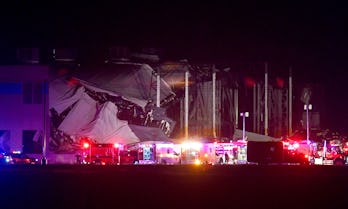 TOPSHOT - First responders surround an Amazon Fulfillment Center in Edwardsville, Illinois, on Decem...