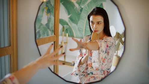 Beautiful woman singing in the bathroom. Smiling and posing