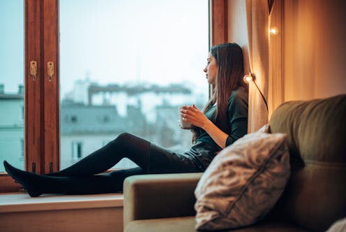 teenager woman with the mug of coffee during the christmas holiday