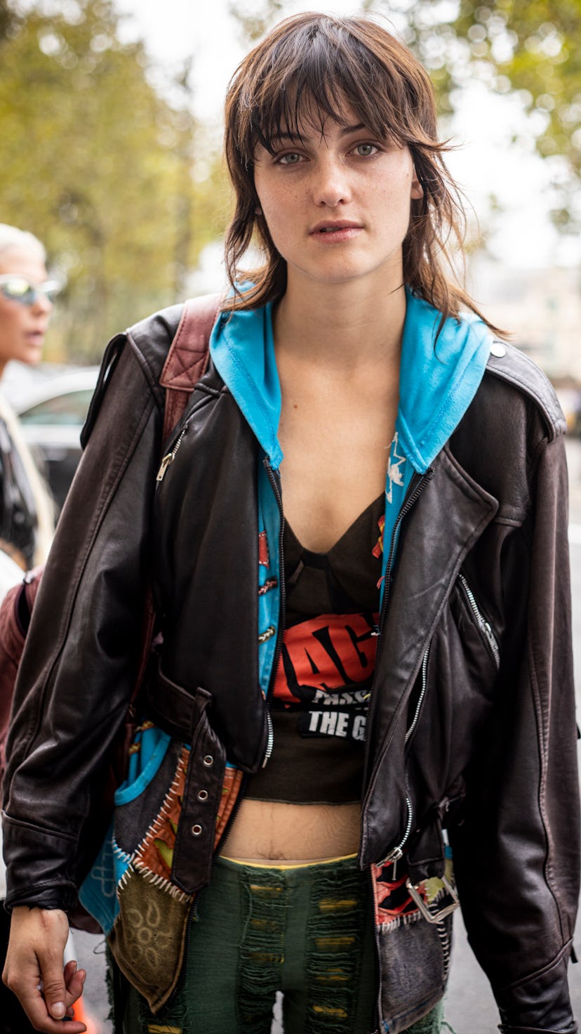 A model with a shag hairdo is seen outside the Unravel show during Paris Fashion Week.