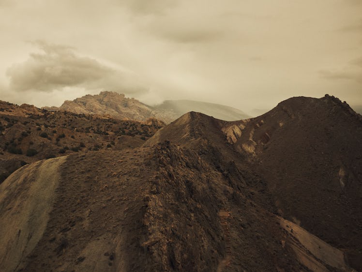 Mars like landscapes taken in the state of Utah, USA. The low cloud and dark, muted colours lend its...