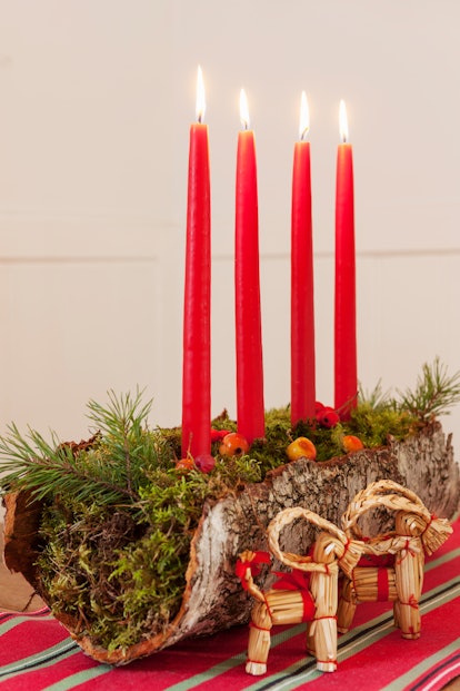 A Yule log centerpiece is perfect for DIY Winter Solstice Party Decorations.