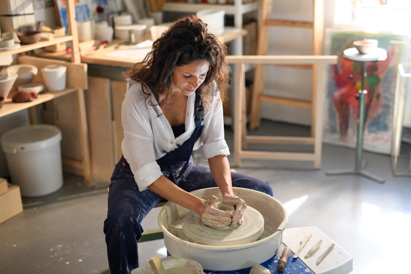 A woman makes a ceramic pot. Here's your daily horoscope for December 16, 2021.