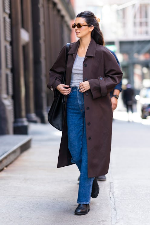 Kendall Jenner wears brown Camilla and Marc duster coat.
