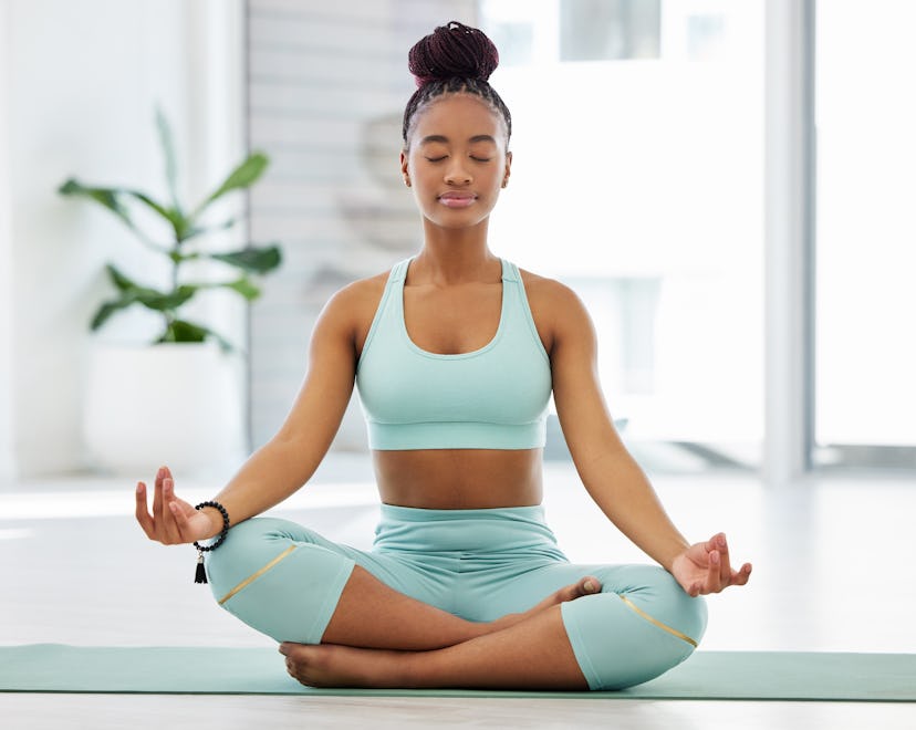 woman doing yoga and meditating