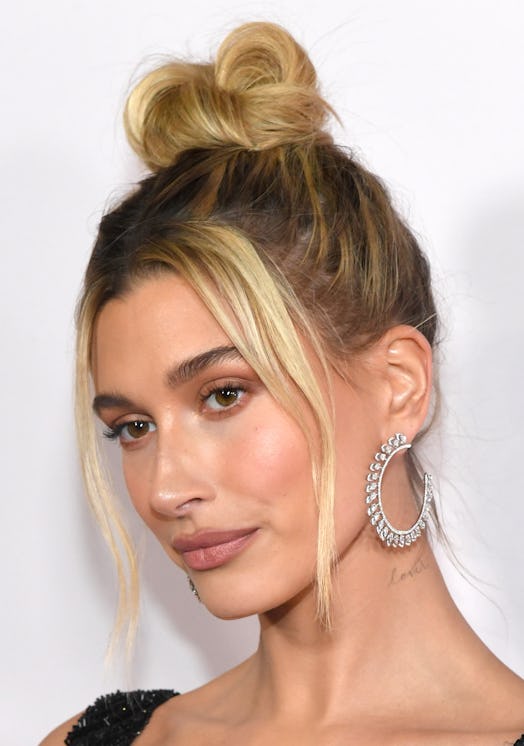Hailey Bieber in one winter hair trend: a middle-parted updo.
