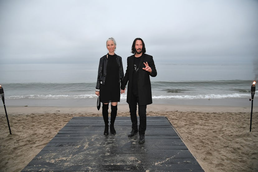 Alexandra Grant and Keanu Reeves attend the Saint Laurent Mens Spring Summer 20 Show Photo Call on J...