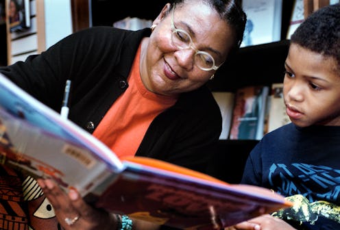 bell hooks  signs her book for a child