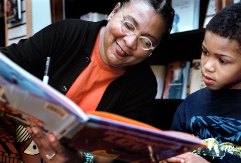 bell hooks  signs her book for a child