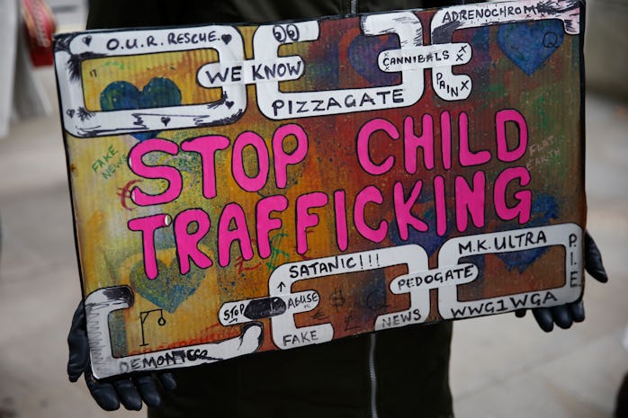 LONDON, ENGLAND - OCTOBER 10: A protestor holds a sign during a "Save our Children" rally outside Do...