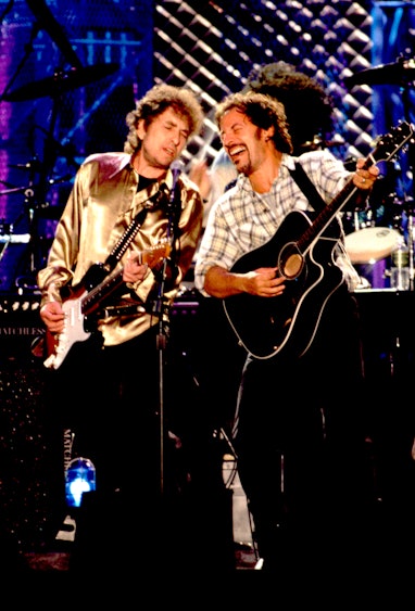 Bob Dylan, left, and Bruce Springsteen performing onstage at the opening of the Rock and Roll Hall o...