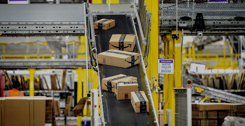 EASTVALE, CA - AUGUST 31: Packages move along a conveyor at Amazon fulfillment center in Eastvale on...