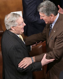 WASHINGTON, DC - MARCH 25:  Senate Majority Leader Mitch McConnell (L) (R-KY) greets Sen. Joe Manchi...