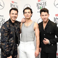 NEW YORK, NEW YORK - DECEMBER 10: (L-R) Kevin Jonas, Joe Jonas, and Nick Jonas of The Jonas Brothers...