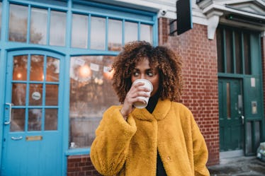 Portrait of a young adult beautiful woman drinking coffee, for which she'll need coffee quotes for I...