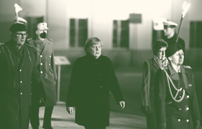 BERLIN, GERMANY - DECEMBER 02: Outgoing German Chancellor Angela Merkel attends her military tattoo ...