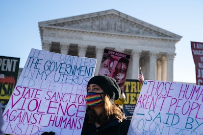 Abortion rights advocates and anti-abortion protesters demonstrate in front of the Supreme Court of ...