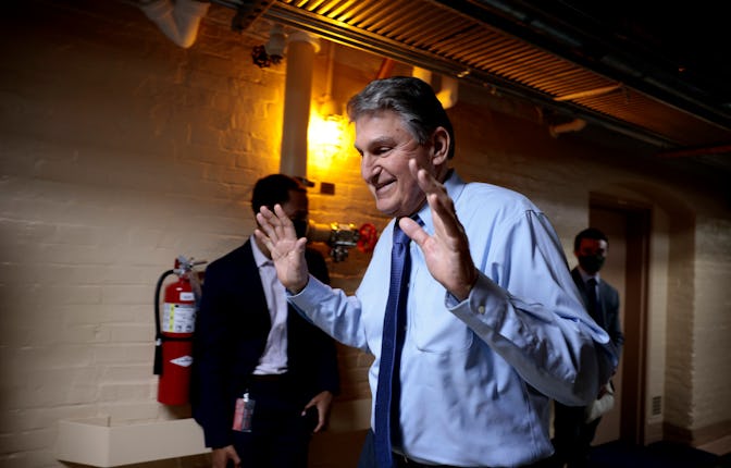 WASHINGTON, DC - DECEMBER 15: Sen. Joe Manchin (D-WV) walks out of a meeting with fellow Democratic ...