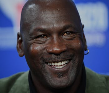 Former NBA star and owner of Charlotte Hornets team Michael Jordan looks on as he addresses a press ...