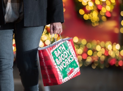 NEW YORK, NEW YORK - NOVEMBER 23: A person carries a shopping bag outside Macy's in Herald Square on...