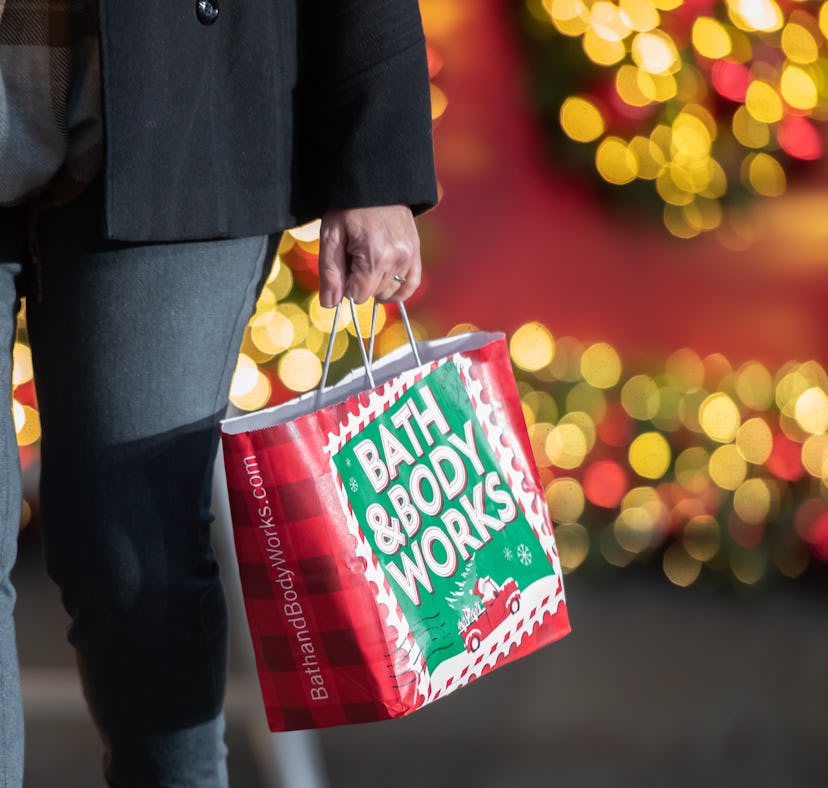 NEW YORK, NEW YORK - NOVEMBER 23: A person carries a shopping bag outside Macy's in Herald Square on...