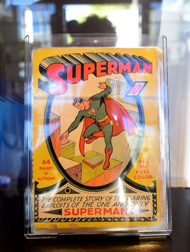 The very first Superman comic book from 1939 is displayed during Batman's cemetary visit is displaye...