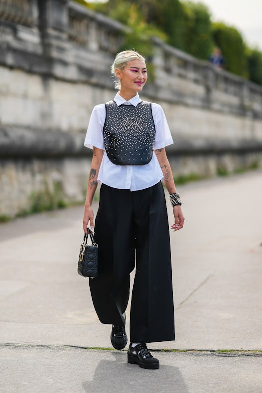 Amalie Gassmann wears high waist, wide-leg pants during Paris Fashion Week on September 28, 2021 in ...