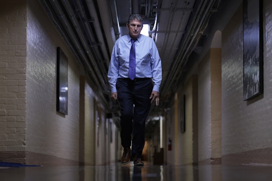 WASHINGTON, DC - DECEMBER 15: U.S. Sen. Joe Manchin (D-WV) walks through a hallway in the basement o...