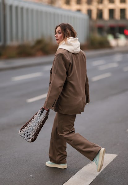 Lisi Rozay wore a Nakd brown suit and Lola beige sweater to create a monochromatic outfit.