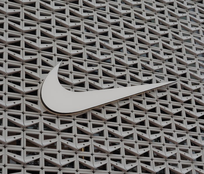 MIAMI BEACH, FLORIDA - DECEMBER 21: The Nike logo hangs above the entrance to the Nike store on Dece...