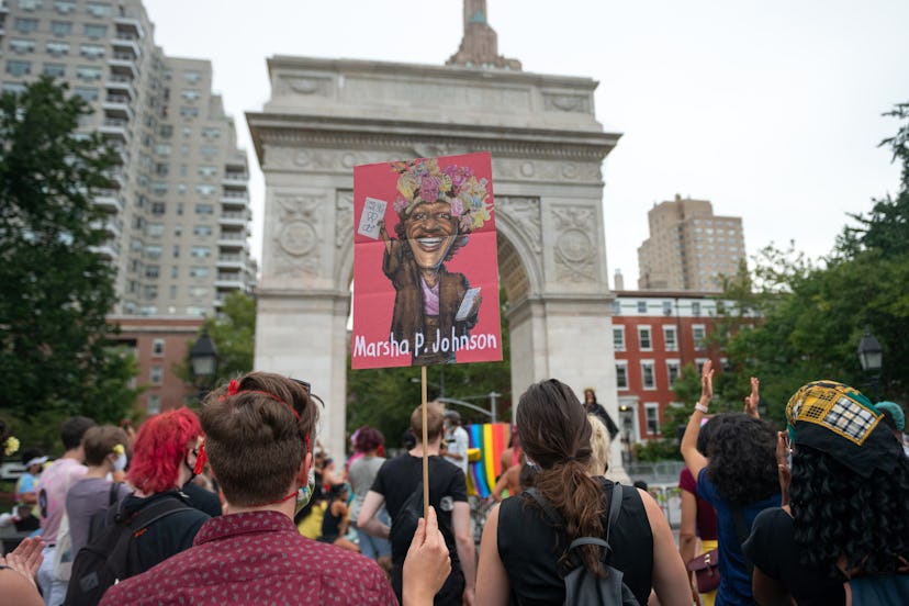 A person holds a "Marsha P. Johnson" sign in 2020.
