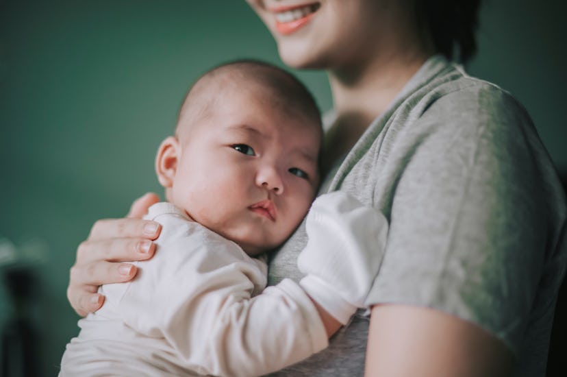 Asian Chinese Mother bonding time with her baby boy toddler at home