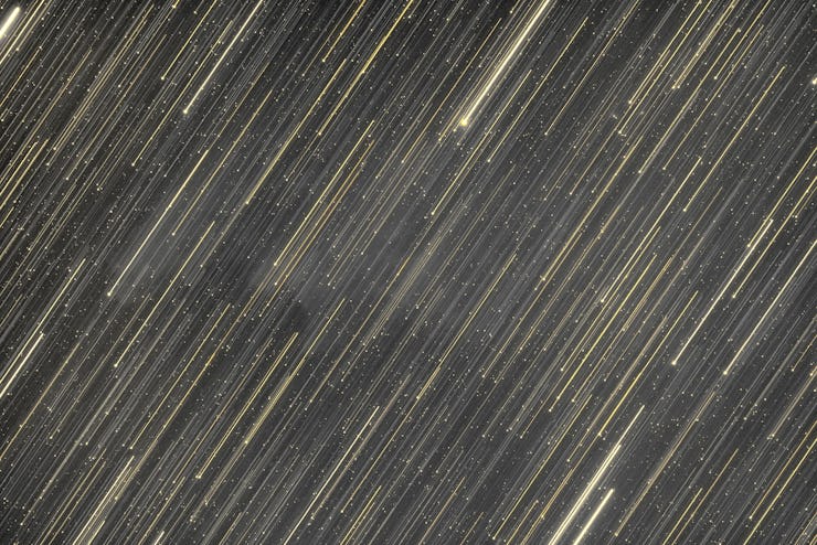 Full frame shot of star trail abstract futuristic background in yellow tones