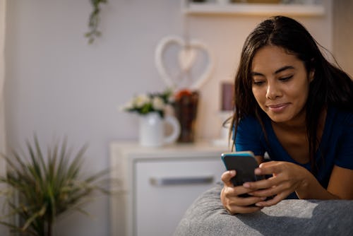 A woman turns on Facebook Dating to use the app's best features.