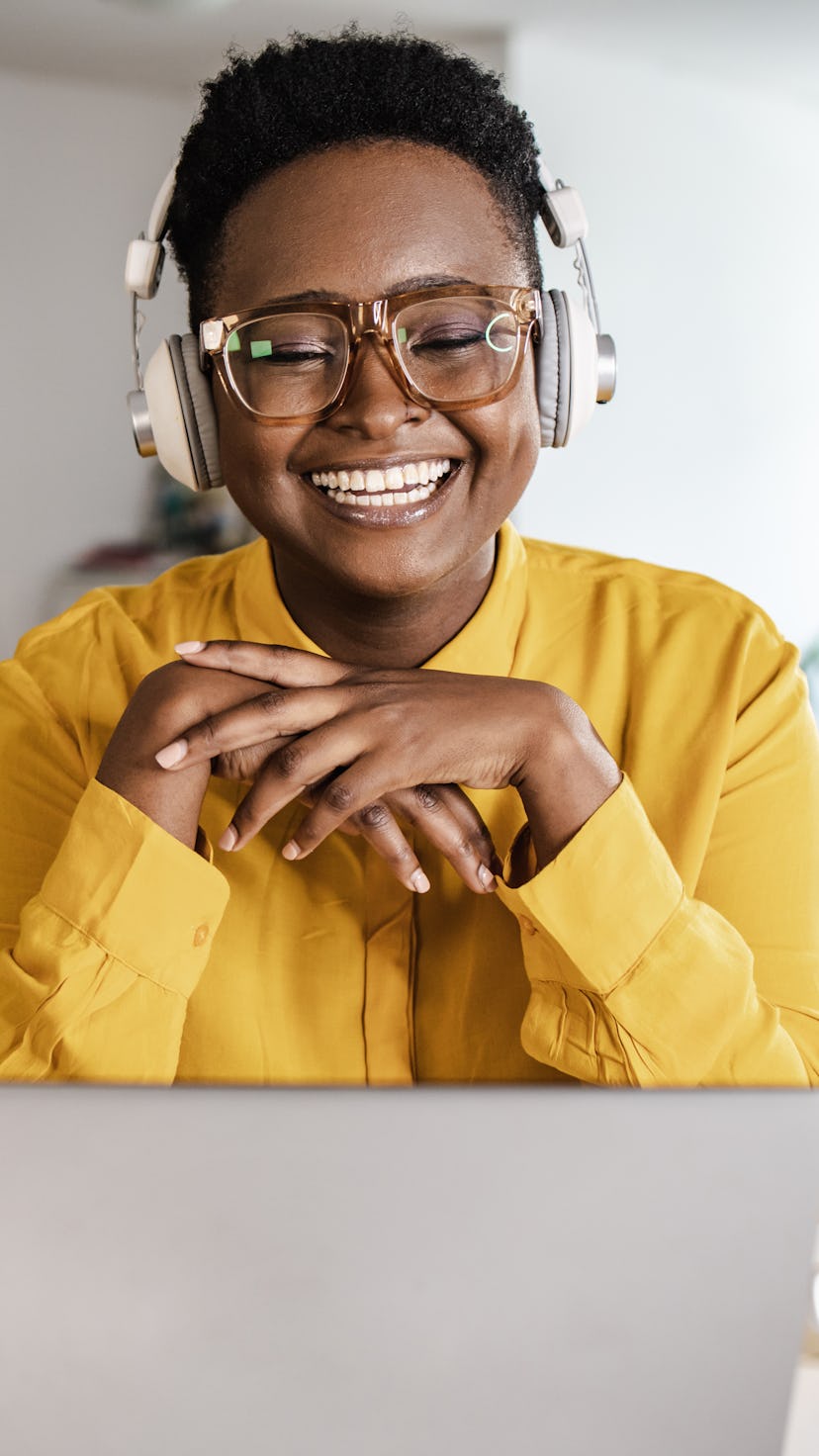Portrait of diligent young businesswoman sitting at her desk. Capricorn season 2021-2022 starts on D...
