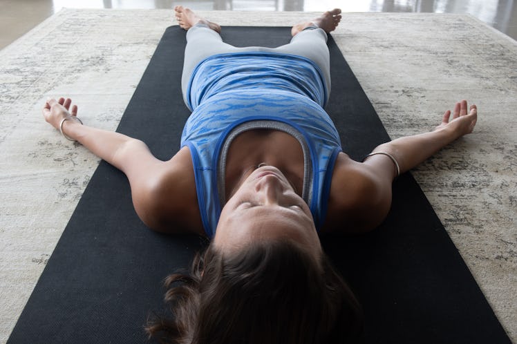 It's time to rest in savasana after your yoga flow sequence for New Year's Day.