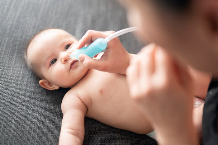 Newborn baby and nose drops