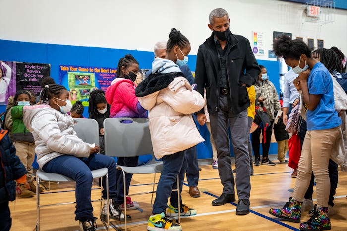 WASHINGTON, DC - NOVEMBER 30: Former U.S. President Barack Obama talks with elementary school studen...
