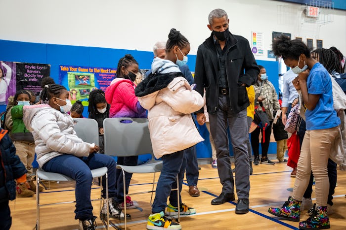 WASHINGTON, DC - NOVEMBER 30: Former U.S. President Barack Obama talks with elementary school studen...