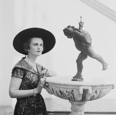 British socialite Margaret Campbell, Duchess of Argyll (1912 - 1993) wearing printed dress and Gains...