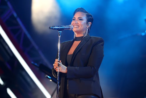 Demi Lovato's buzzcut marks a departure from their recent looks. Photo via Getty Images