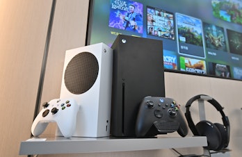 Microsoft's Xbox Series X (black) and series S (white) gaming consoles are displayed at a flagship s...