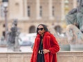 PARIS, FRANCE - DECEMBER 14: Emilie Joseph @in_fashionwetrust wears black sunglasses, gold large ear...