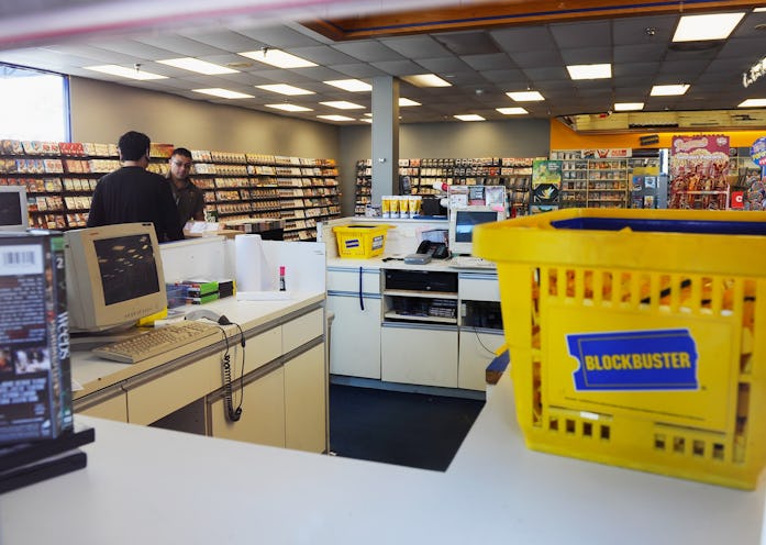 GLENDALE, CA - SEPTEMBER 23:  A UPS driver makes a delivery at Blockbuster store on September 23, 20...