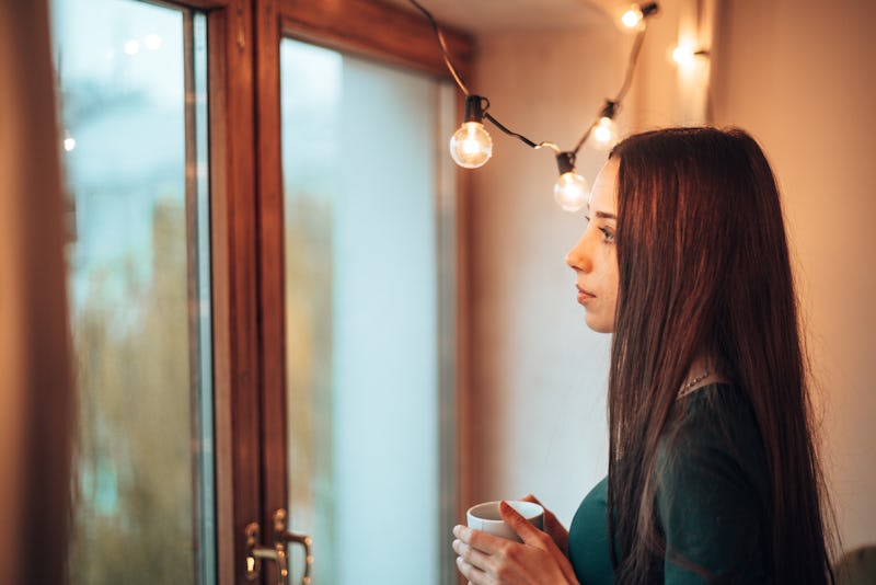 teenager woman with the mug of coffee during the christmas holiday