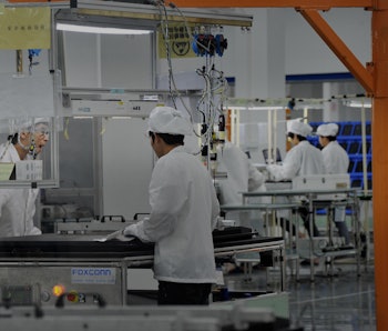 GUIYANG, CHINA - JULY 10:  (CHINA OUT) Employess work at Foxconn demonstration plant on July 10, 201...