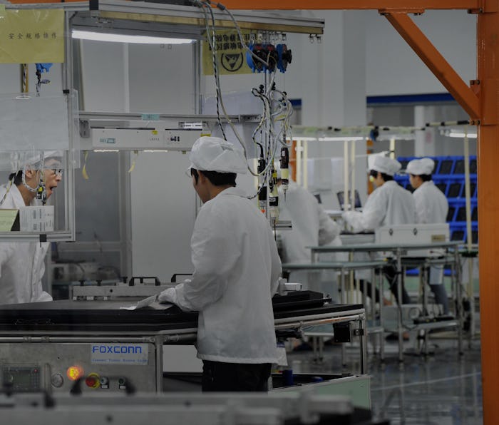 GUIYANG, CHINA - JULY 10: (CHINA OUT) Employess work at Foxconn demonstration plant on July 10, 201...